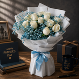 Elegant white rose Father’s Day bouquet with blue fillers and premium wrapping